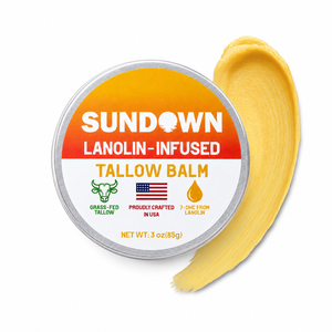 Lanolin-infused tallow balm from SunDown Cosmetics shown in a jar with natural ingredients and a rustic label.